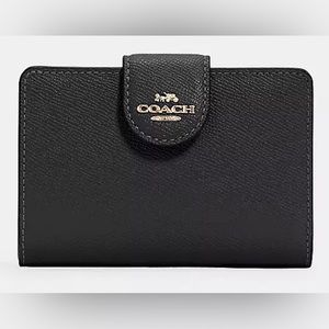 COACH WALLET - medium corner zip style.
